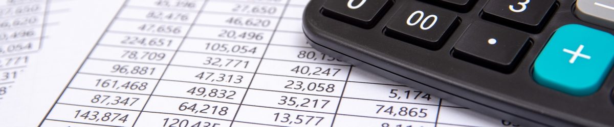 A calculator on financial chart, business concept